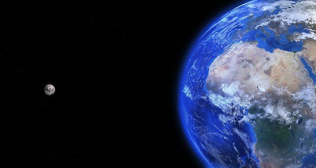 Image of planet earth and, farther away, another blue planet